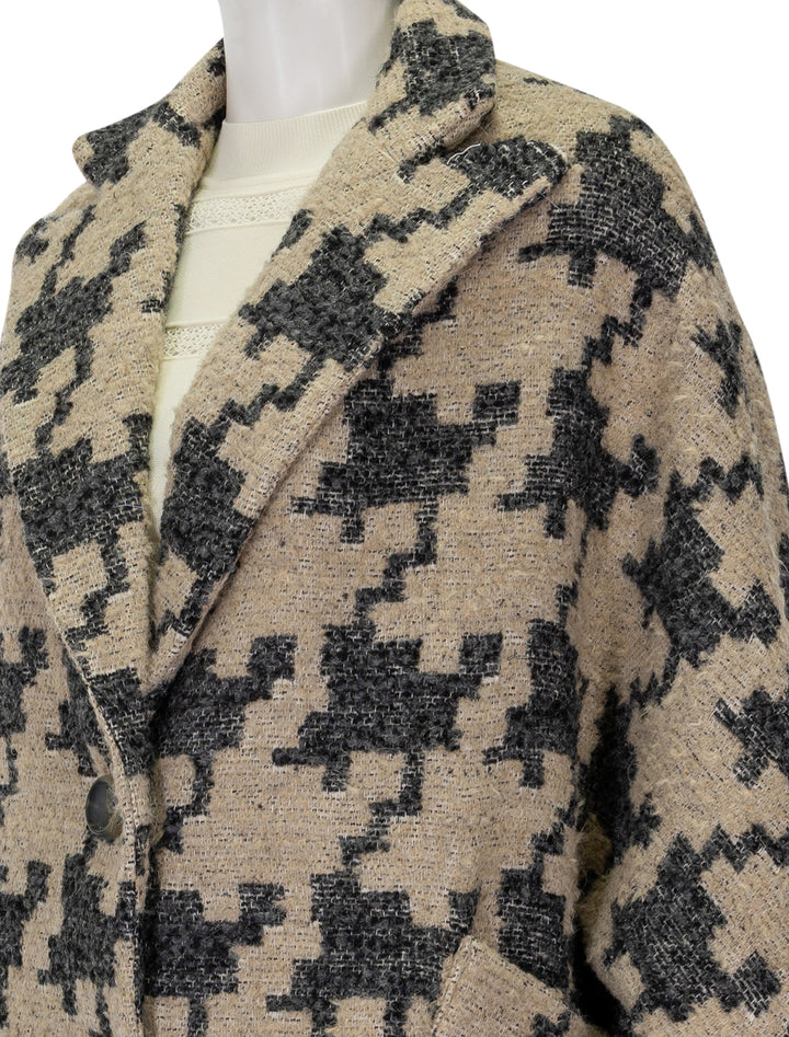 close up image of oversized swing coat in oatmeal houndstooth