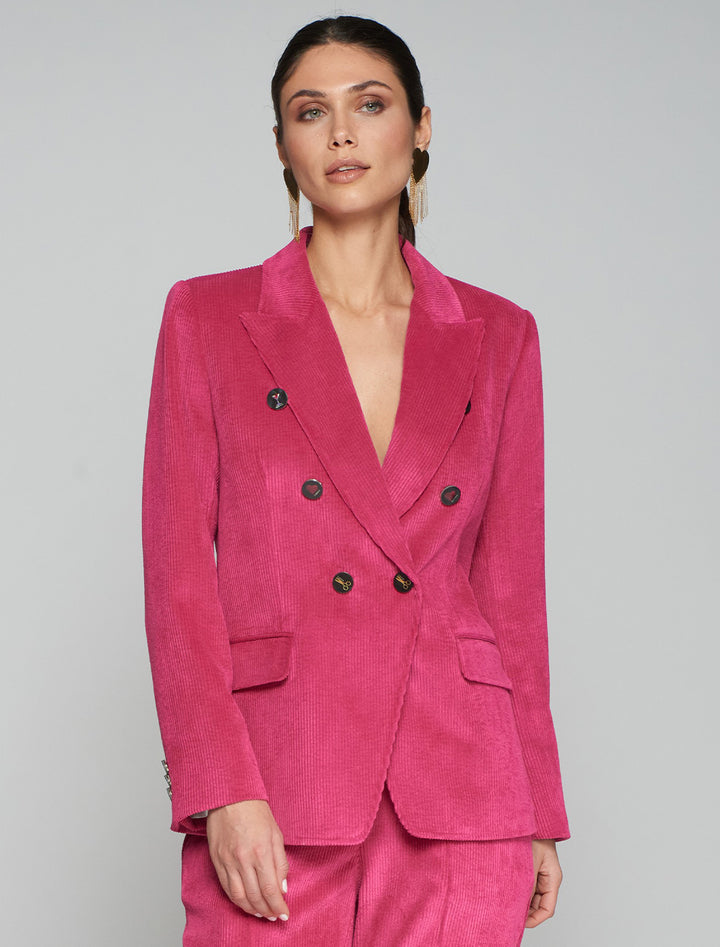 Model wearing Vilagallo's ingrid pink corduroy blazer.