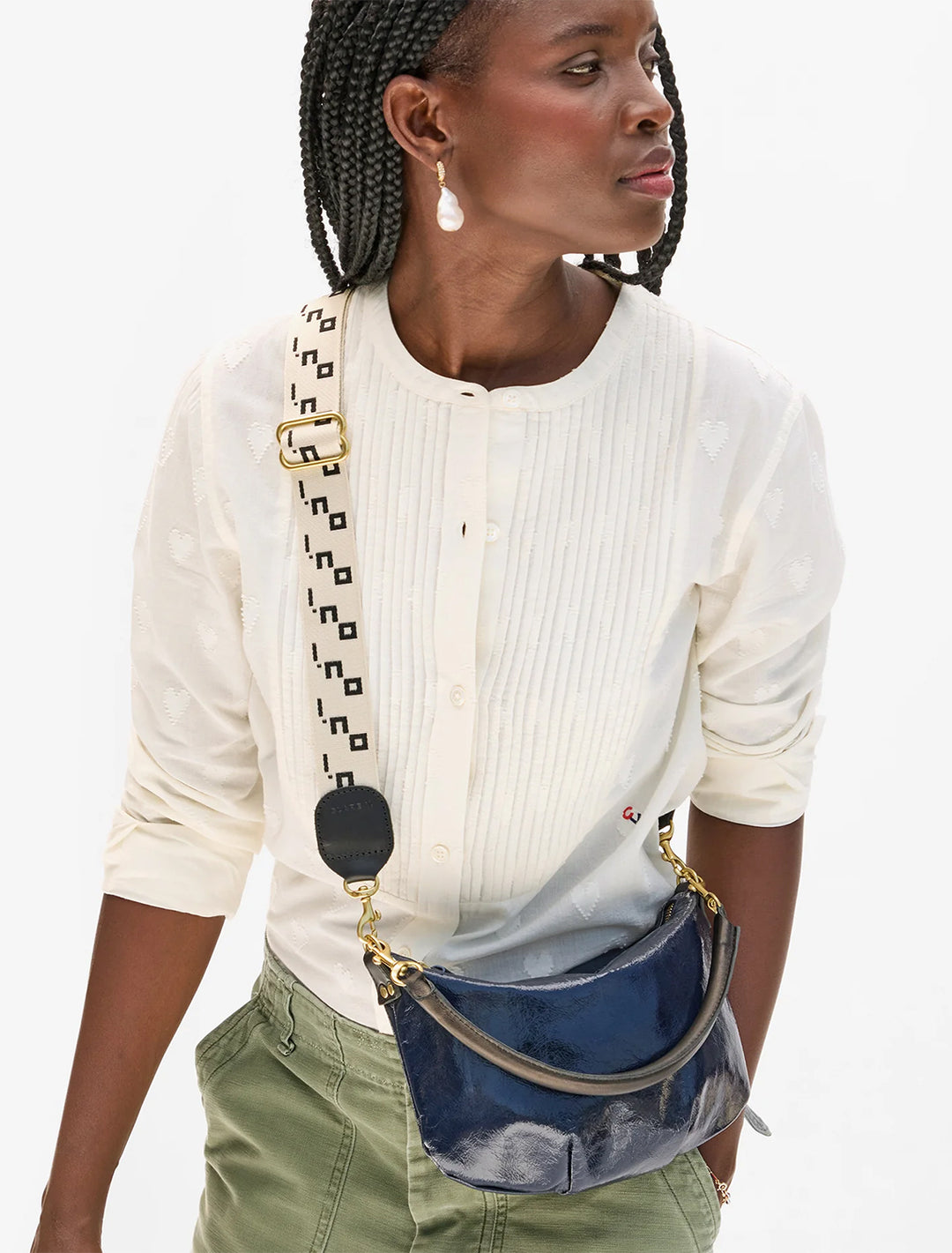 model wearing adjustable crossbody strap in cream and black oui