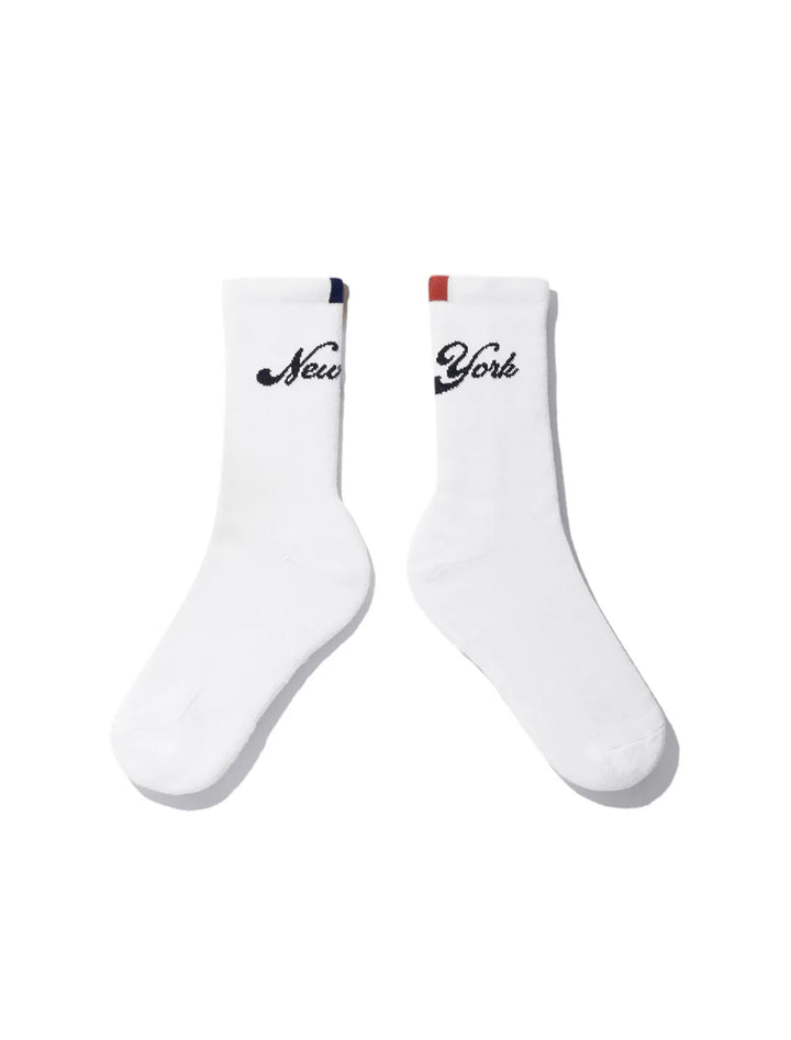 Overhead view of kule's new york socks in white.