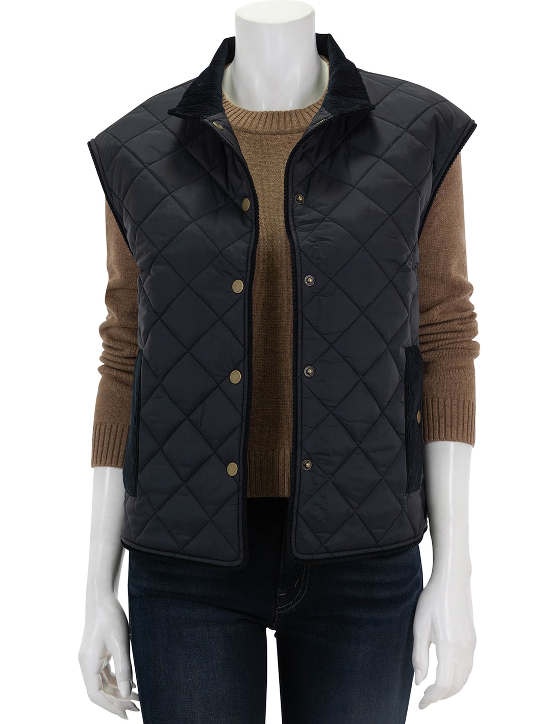 Front view of KULE's the rupert quilted vest in black, unbuttoned.