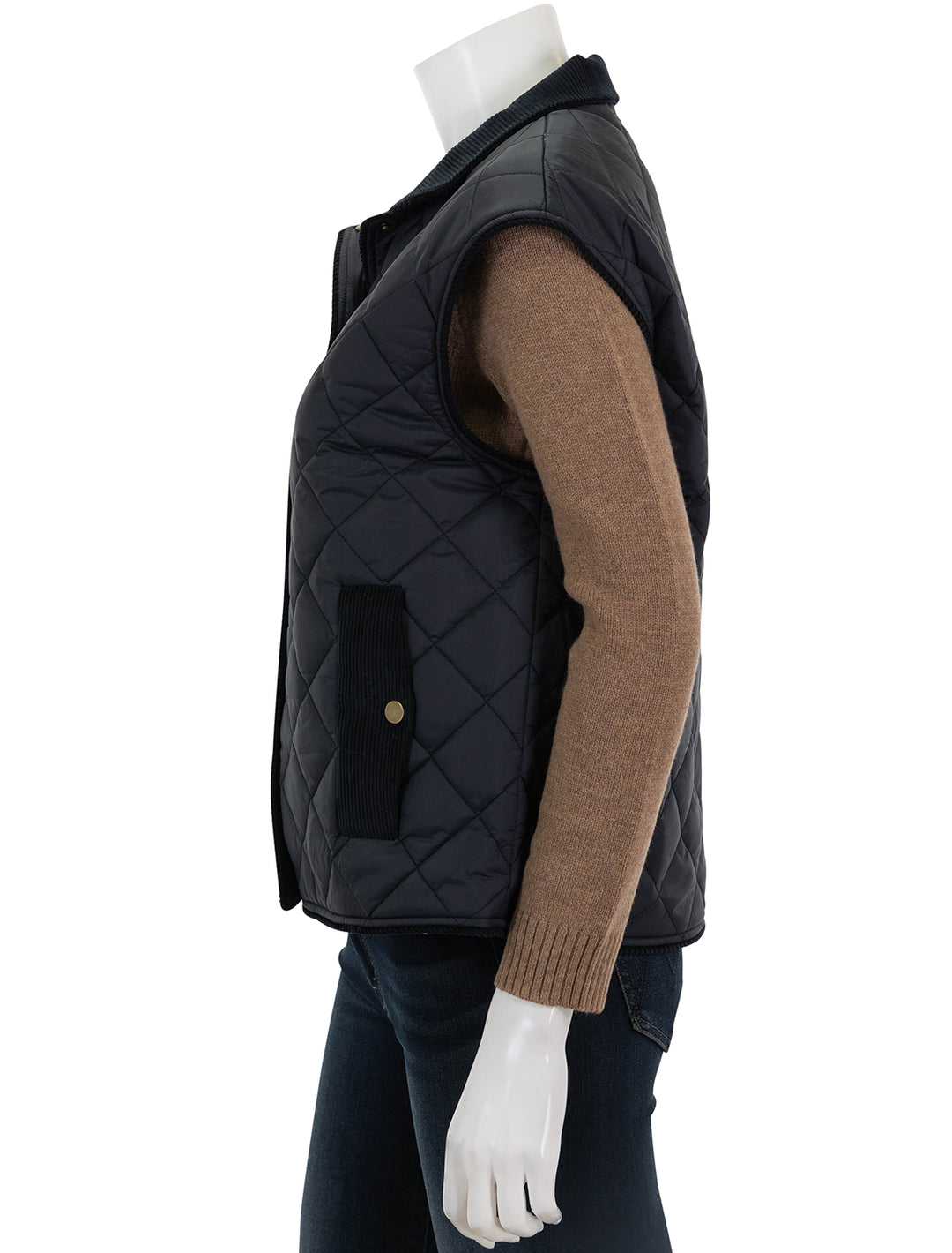 Side view of KULE's the rupert quilted vest in black.