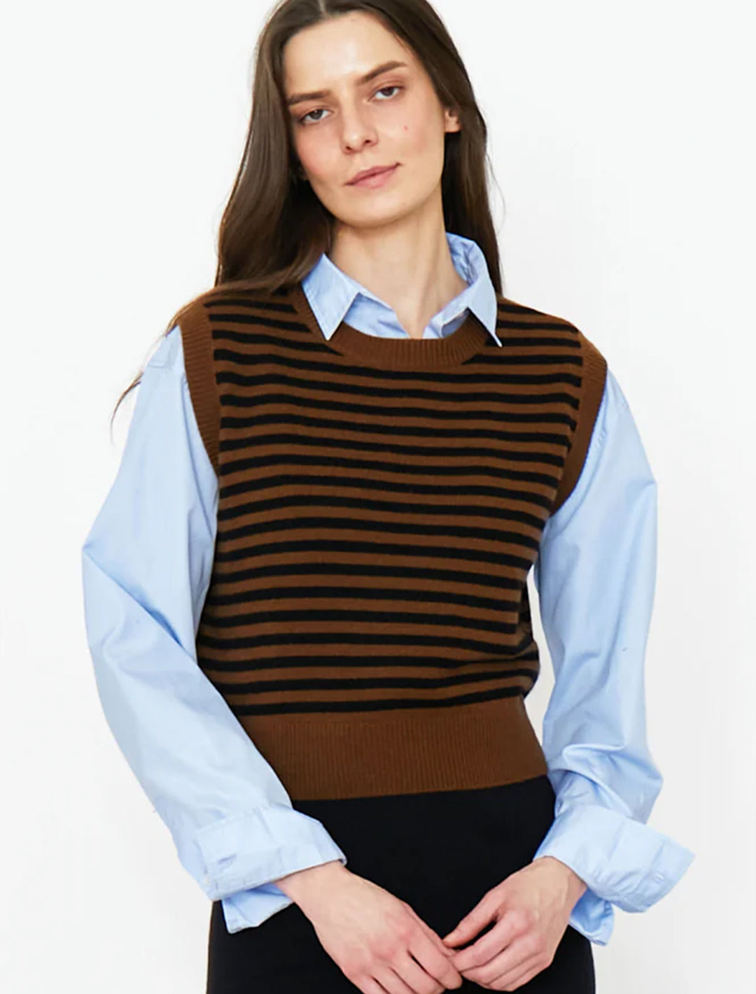 Model wearing Kule's the sam vest in vicuna and black stripe.