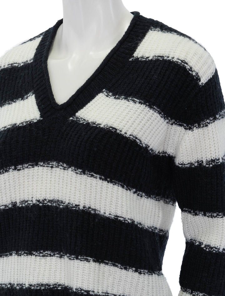 Close-up view of ATM's v neck pullover in black and chalk.