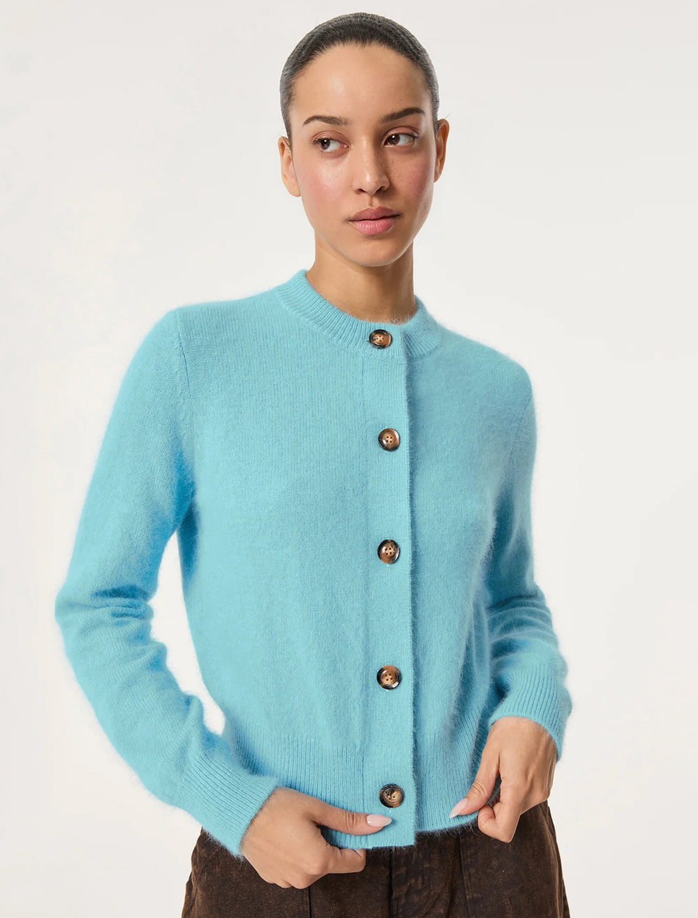 Model wearing Rhode's amal cardigan in blue.