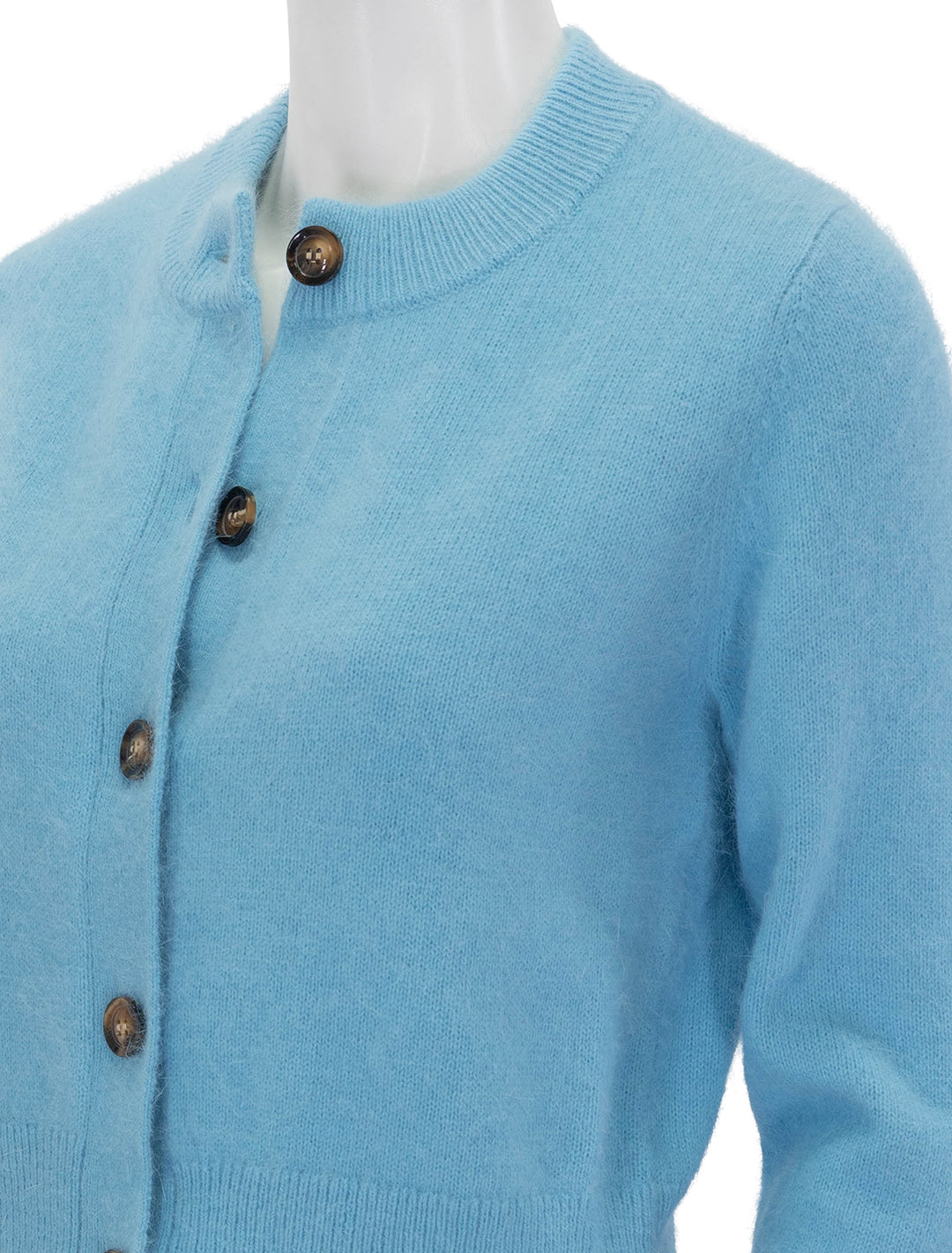 Close-up view of Rhode's amal cardigan in blue.