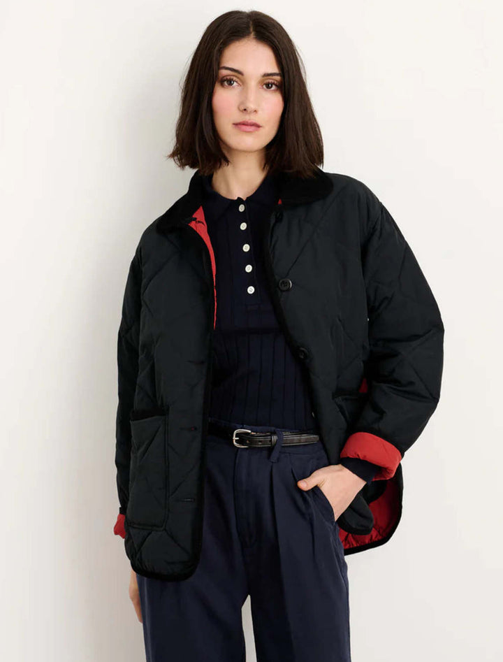 Model wearing Alex Mill's quinn quilted jacket in black.