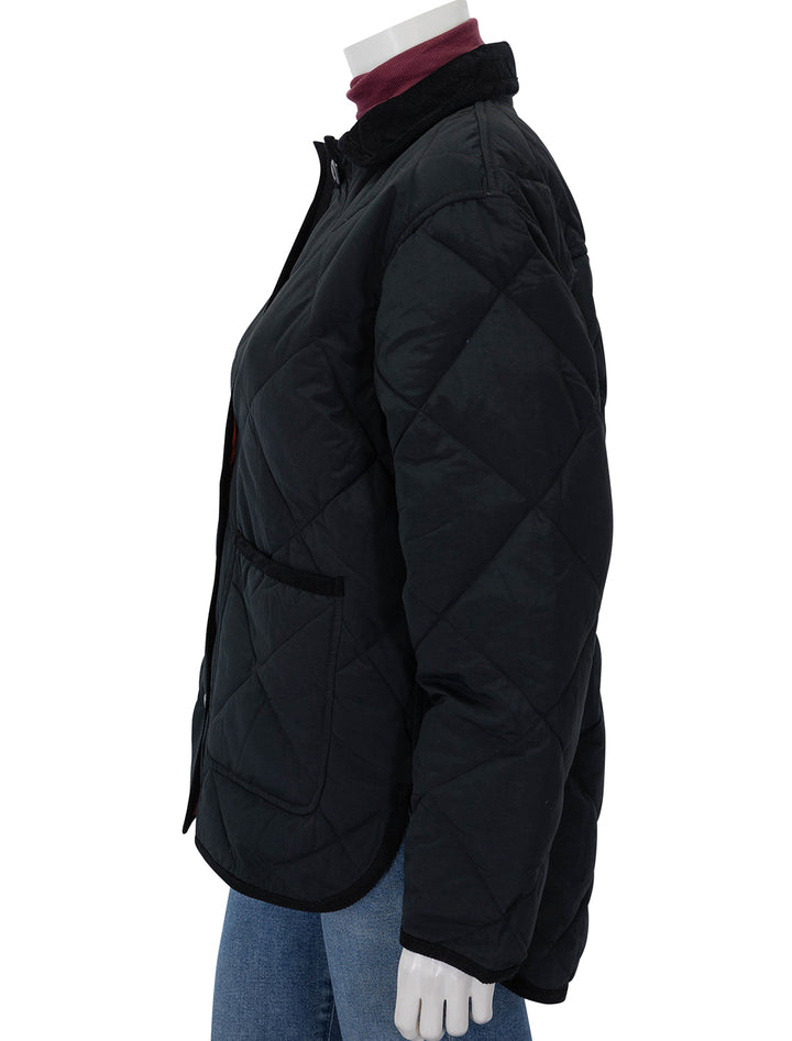 Side view of Alex Mill's quinn quilted jacket in black.