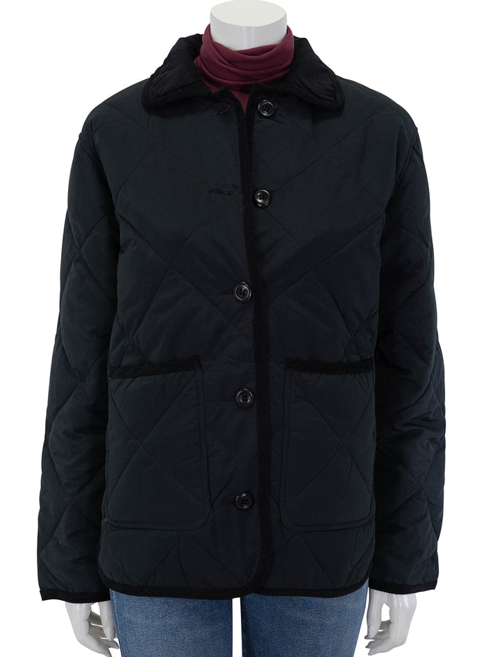 Front view of Alex Mill's quinn quilted jacket in black, buttoned.