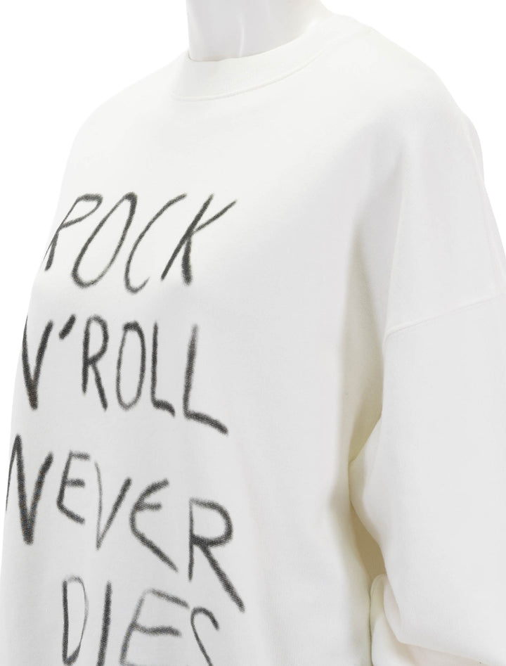Close-up view of Anine Bing's rock n roll never dies miles sweatshirt.