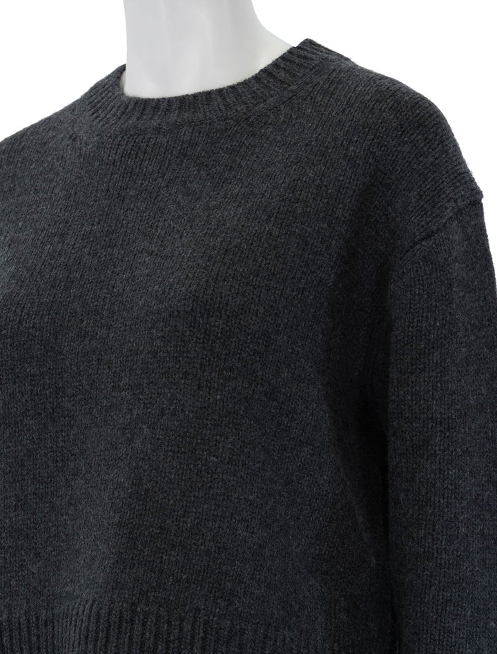 Close-up view of Nili Lotan's haisley sweater in dark charcoal.