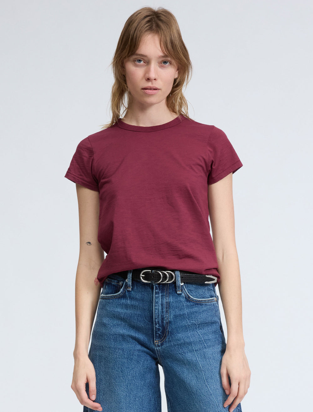 Model wearing Rag & Bone's the slub tee in burgundy.