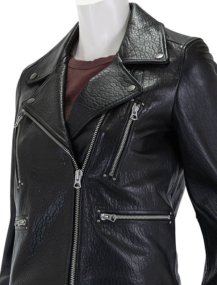 Close-up view of Rag & Bone's arrow leather jacket in black.