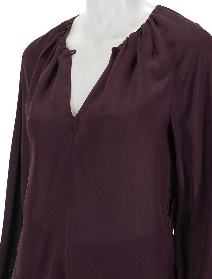 Close-up view of STAUD's fabian top in merlot.