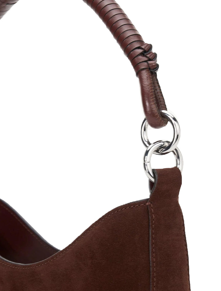 Close-up view of Staud's mel shoulder bag in mahogany suede.