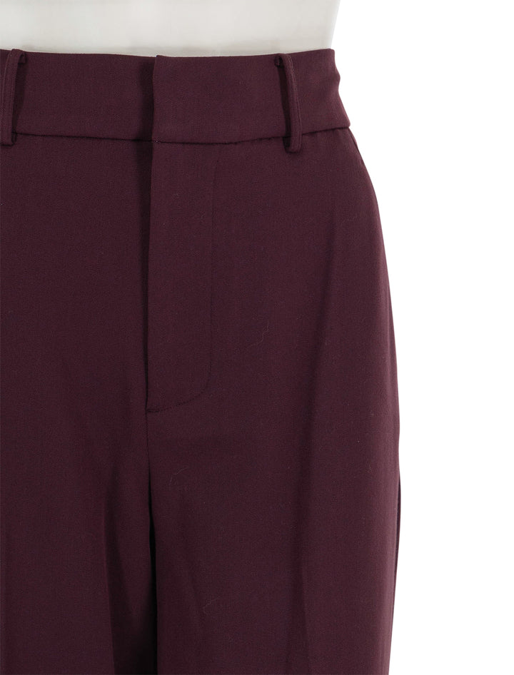 Close-up view of STAUD's prince pant in merlot.