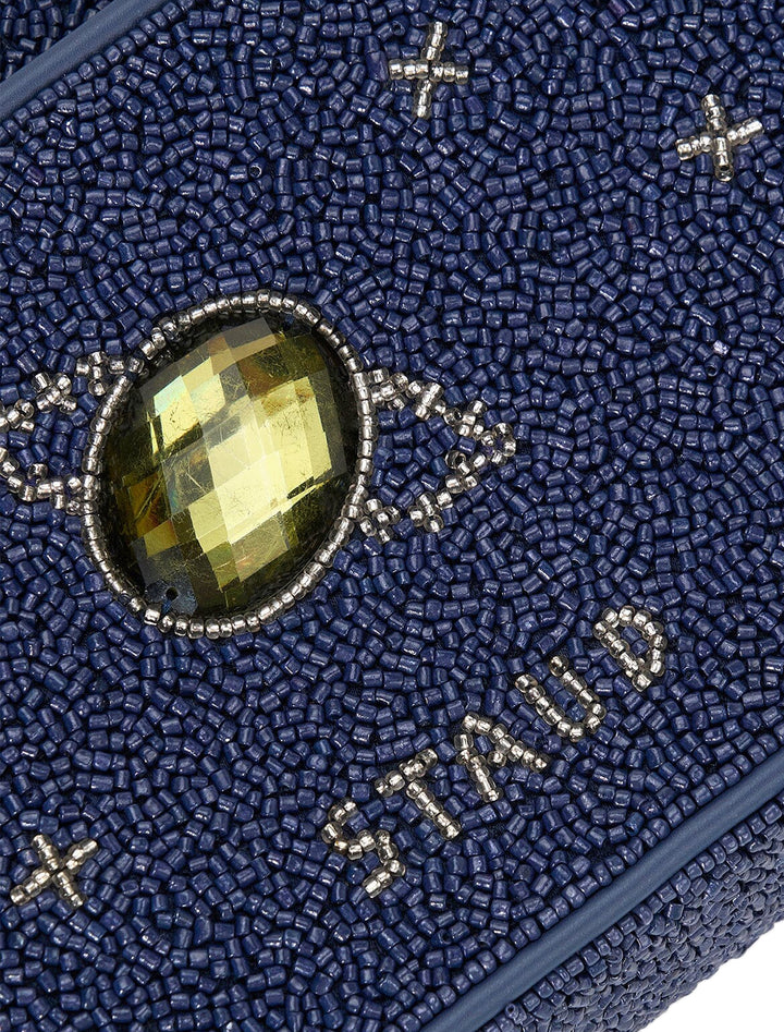 Close-up view of Staud's tommy bag in navy celestial.