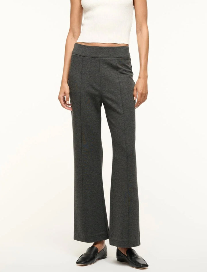 Model wearing STAUD's knack pant in heather grey.