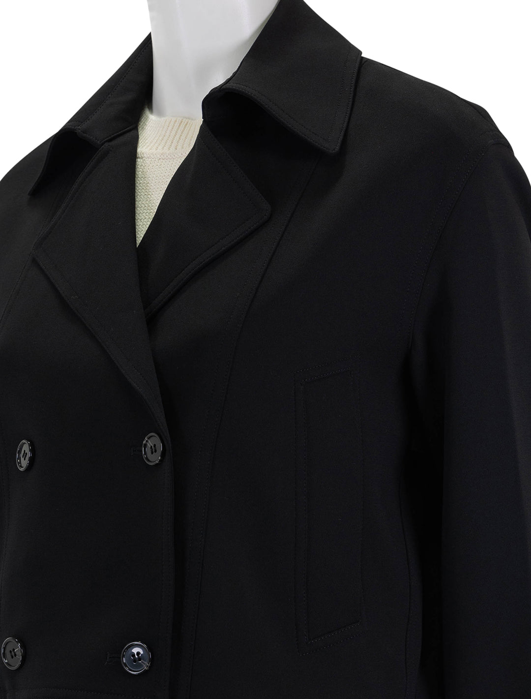 close up view of oversized cropped trench in black