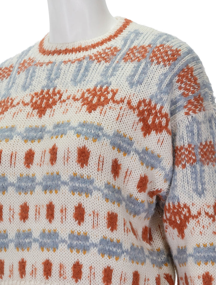 Close-up view of Mother's long drop pullover in dharma karma.