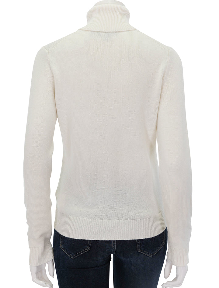 Back view of Theory's classic cashmere turtleneck in ivory.