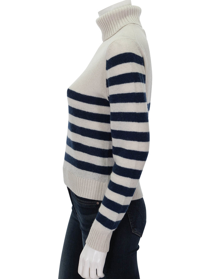 Side view of Jumper 1234's Invert Stripe Roll Collar in Jasmine and Shark.