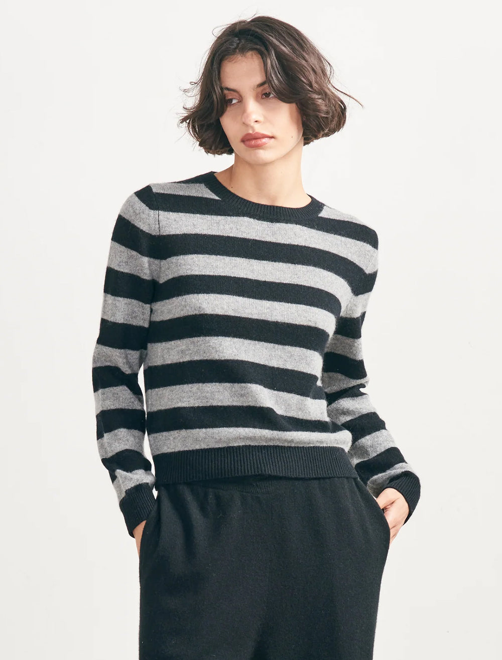 Model wearing Jumper 1234's Stripe Crew in Black and Mid Grey.