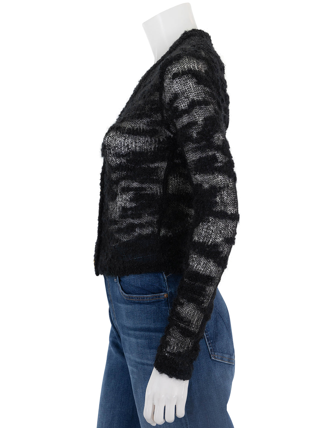 Side view of GANNI's boucle cardigan in black.