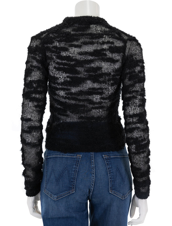 Back view of GANNI's boucle cardigan in black.