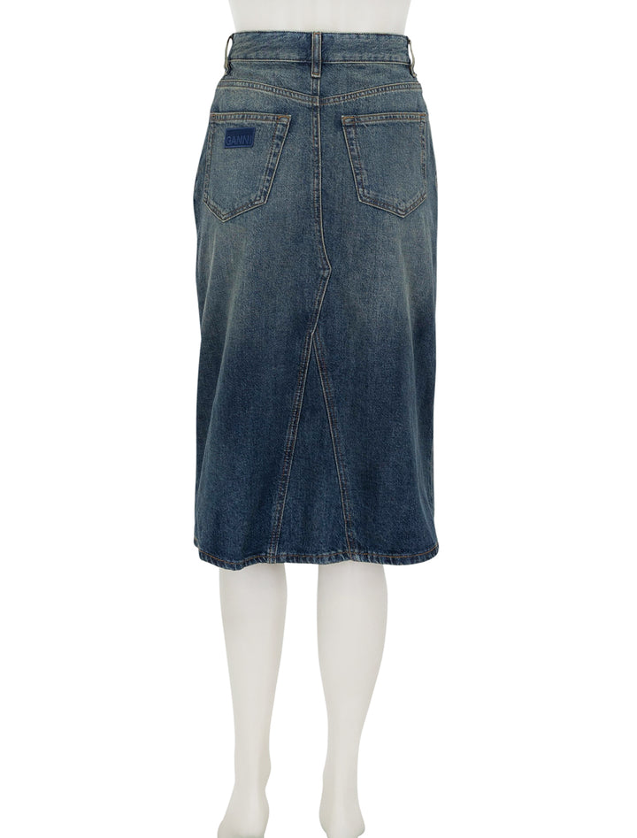 Back view of GANNI's denim midi skirt in mid blue vintage.