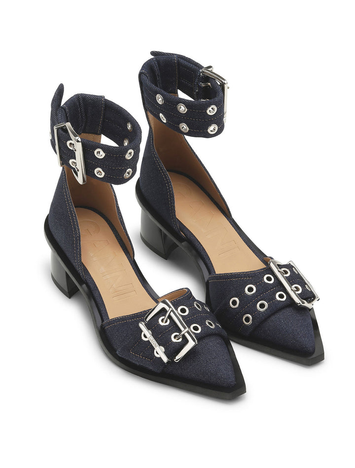 Overhead angle view of GANNI's feminine buckle open cut pump in denim.