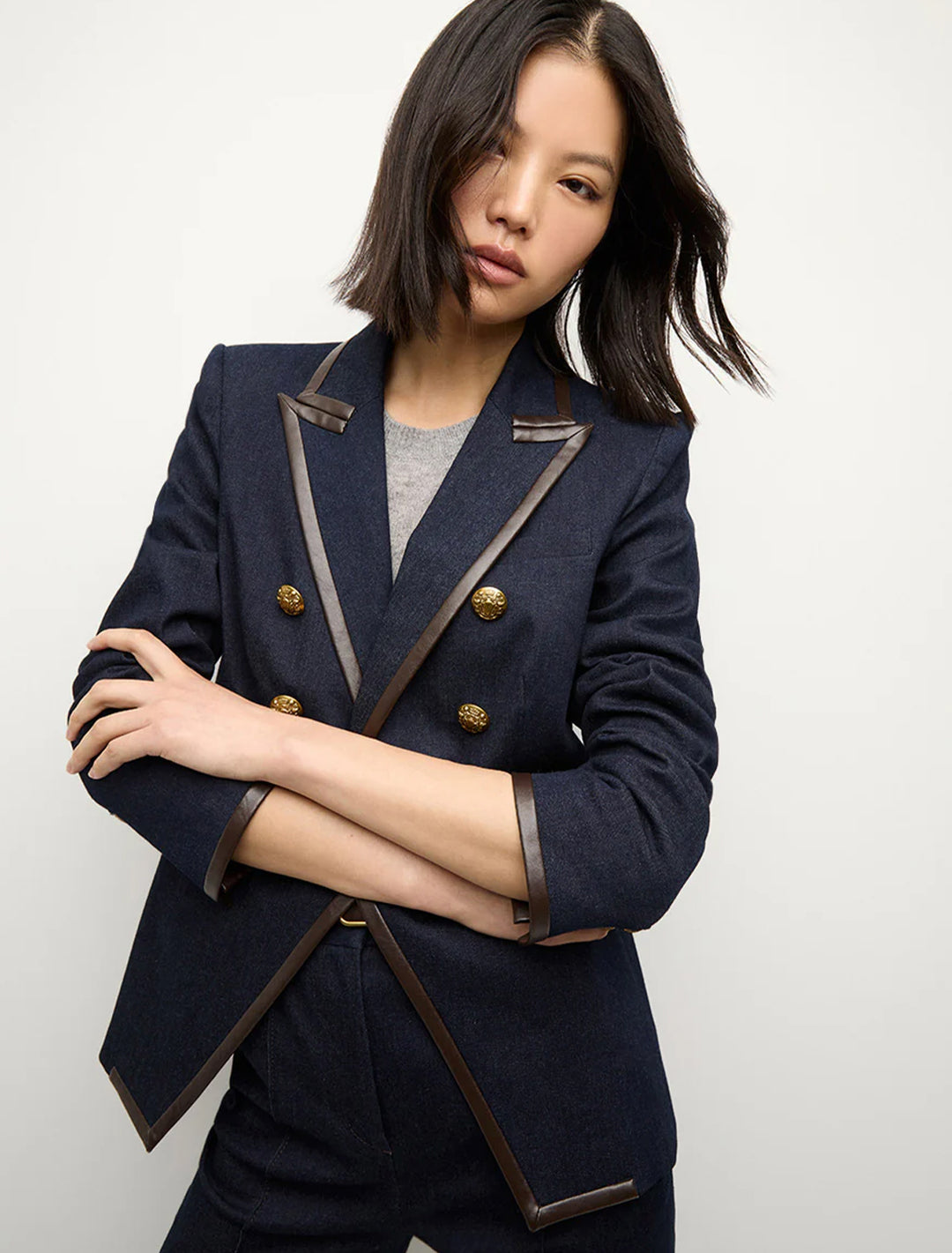 Model wearing Veronica Beard's miller dickey jacket midnight wash.