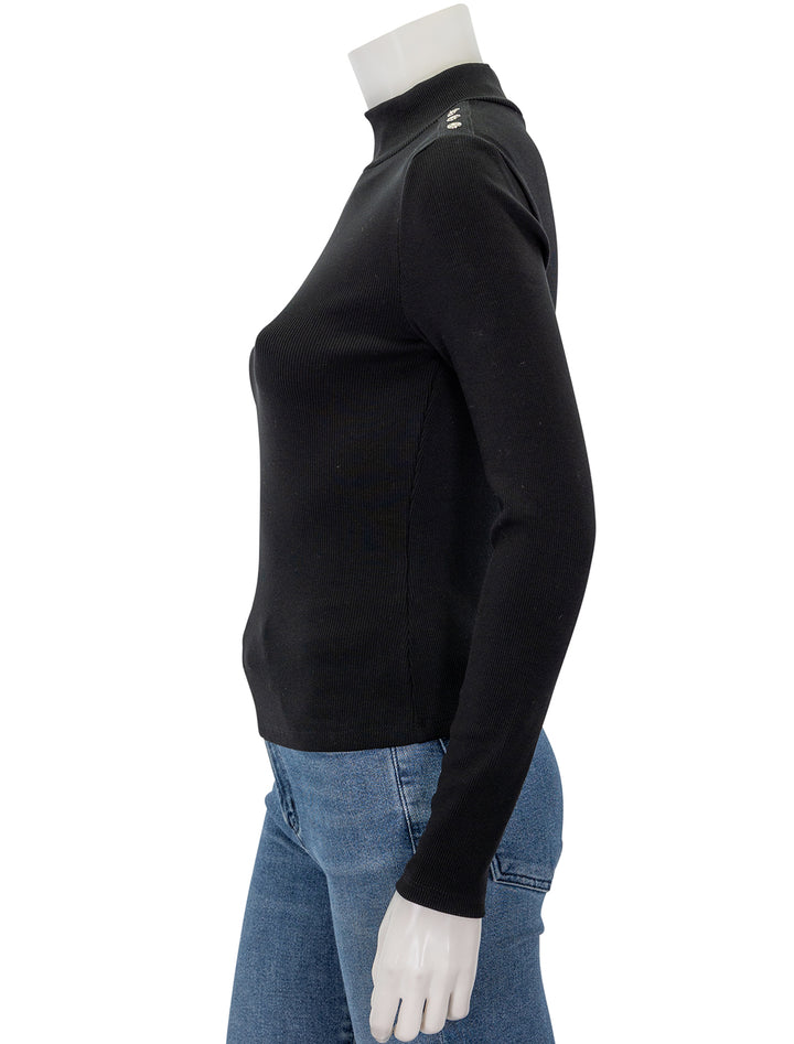 Side view of Veronica Beard's nate top with buttons in black.