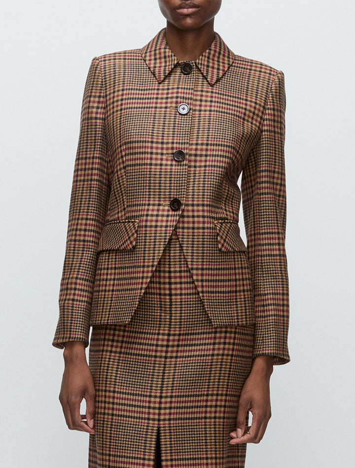 Model wearing Veronica Beard's aire dickey jacket in camel and black plaid.