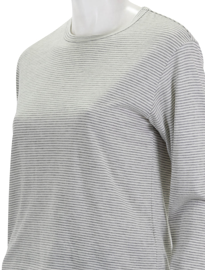 Close-up view of ATM's micro stripe long sleeve crew neck tee in grey and white.