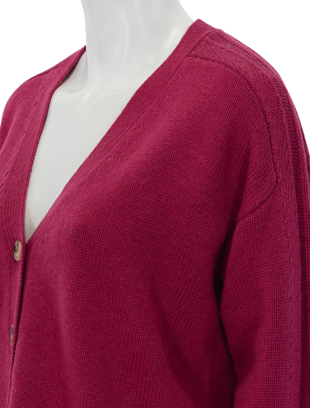 Close-up view of ATM's merino blend cardigan in rubellite.