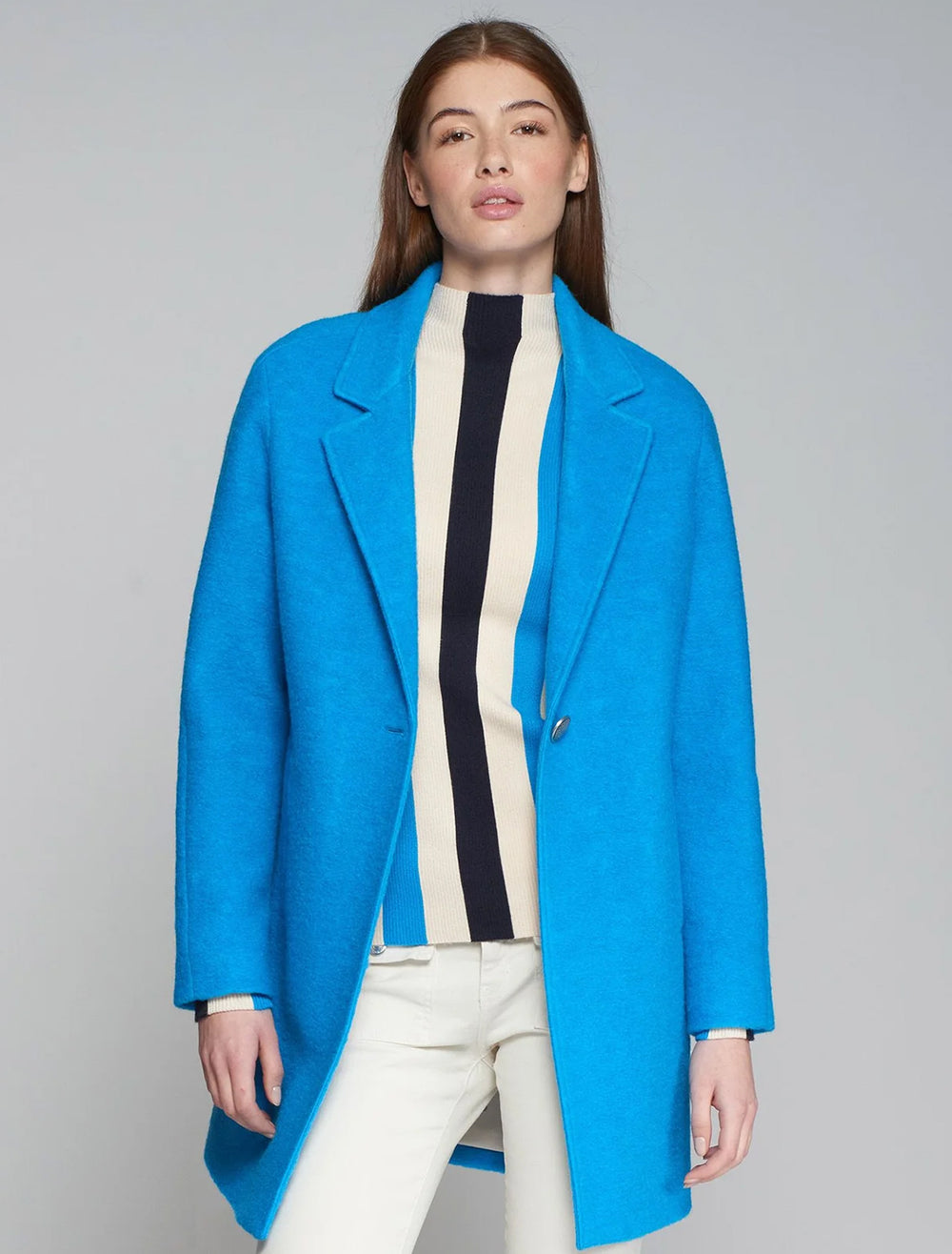 Model wearing Vilagallo's alberta coat in bright blue.