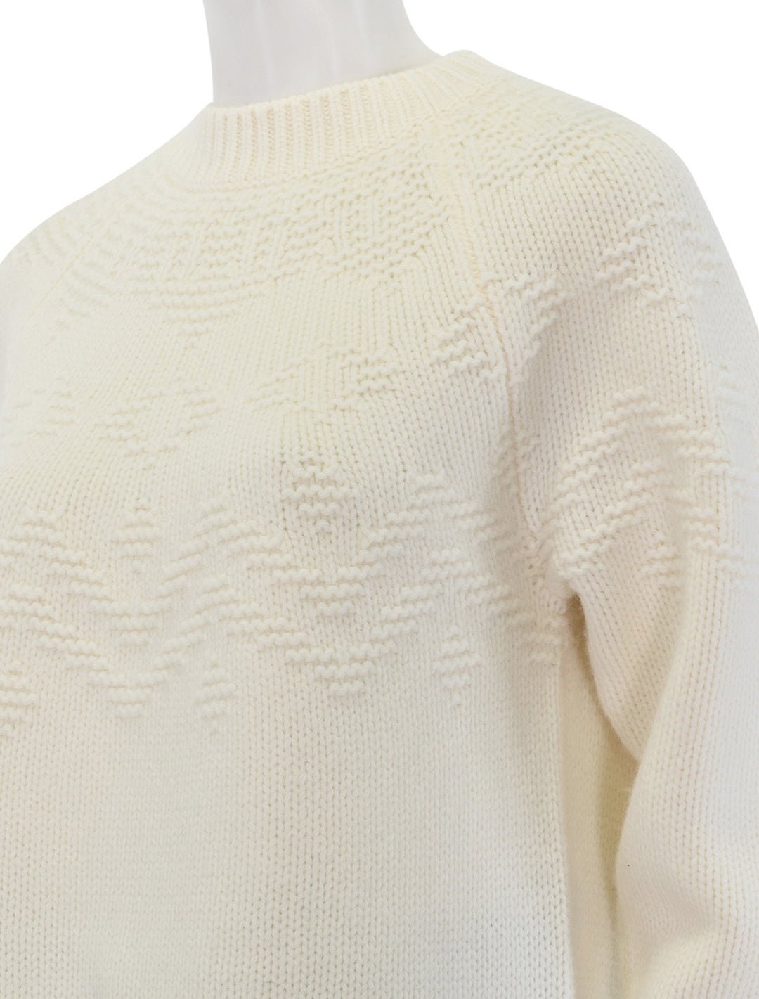 Close-up view of Vince's textured raglan fair isle in off white.