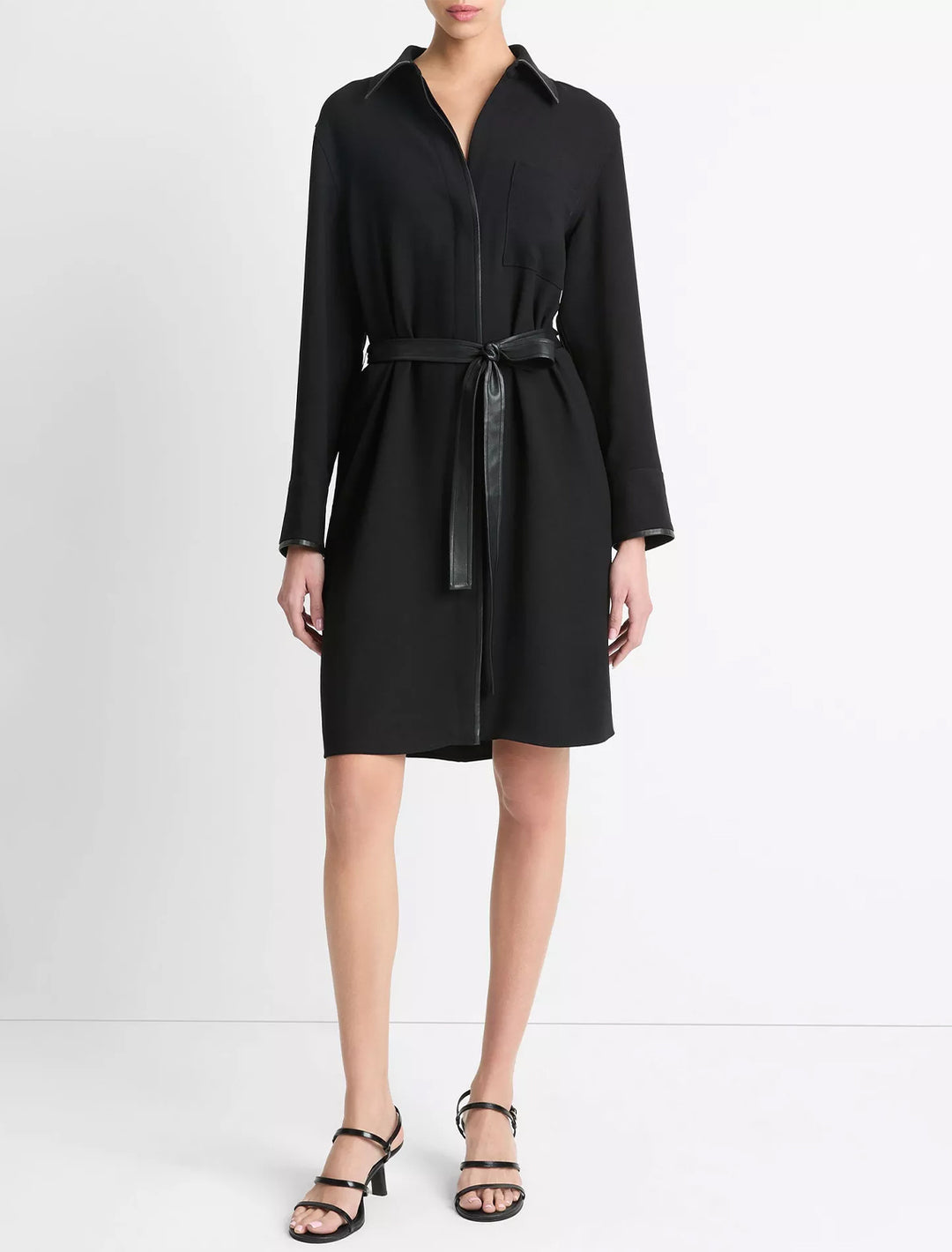 Model wearing Vince's leather trim shirt dress in black.