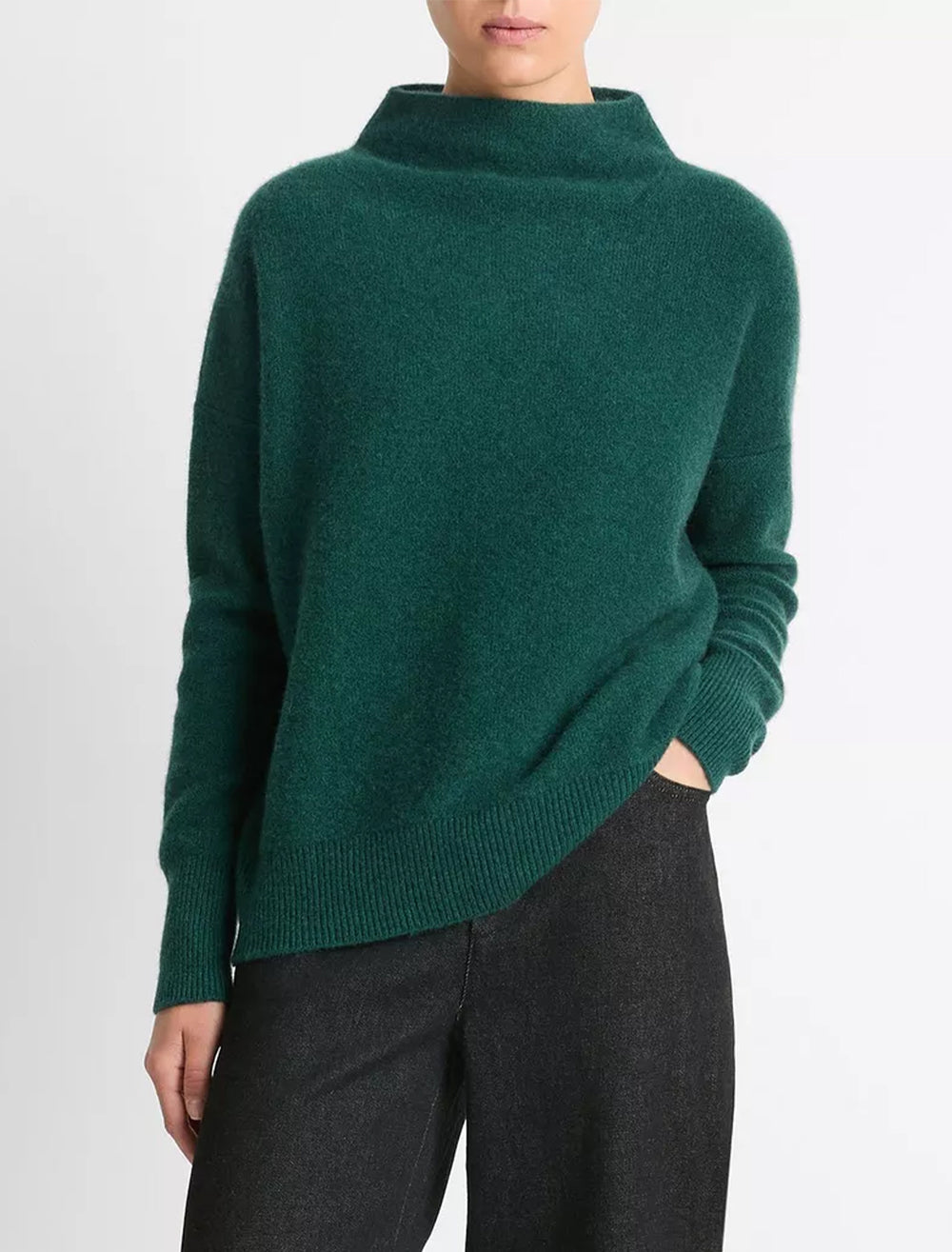 Model wearing Vince's boiled funnel neck pullover in heather jade.