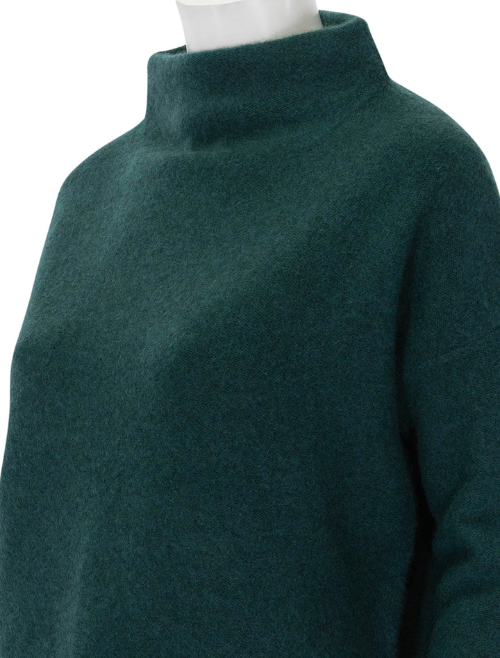 Close-up view of Vince's boiled funnel neck pullover in heather jade.