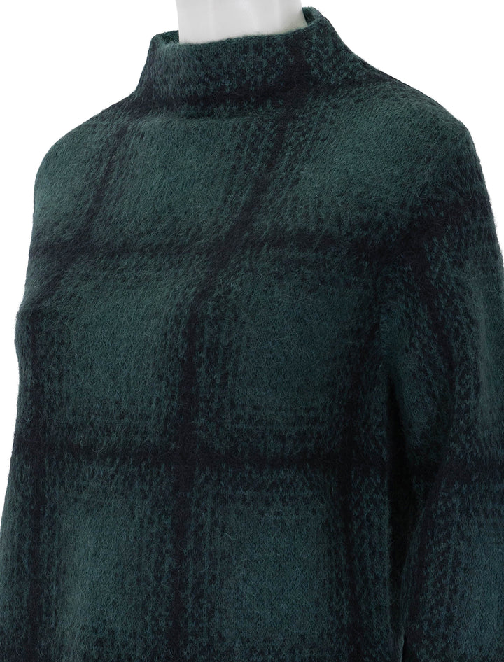 Close-up view of Vince's shadow plaid funnel neck pullover in juniper.