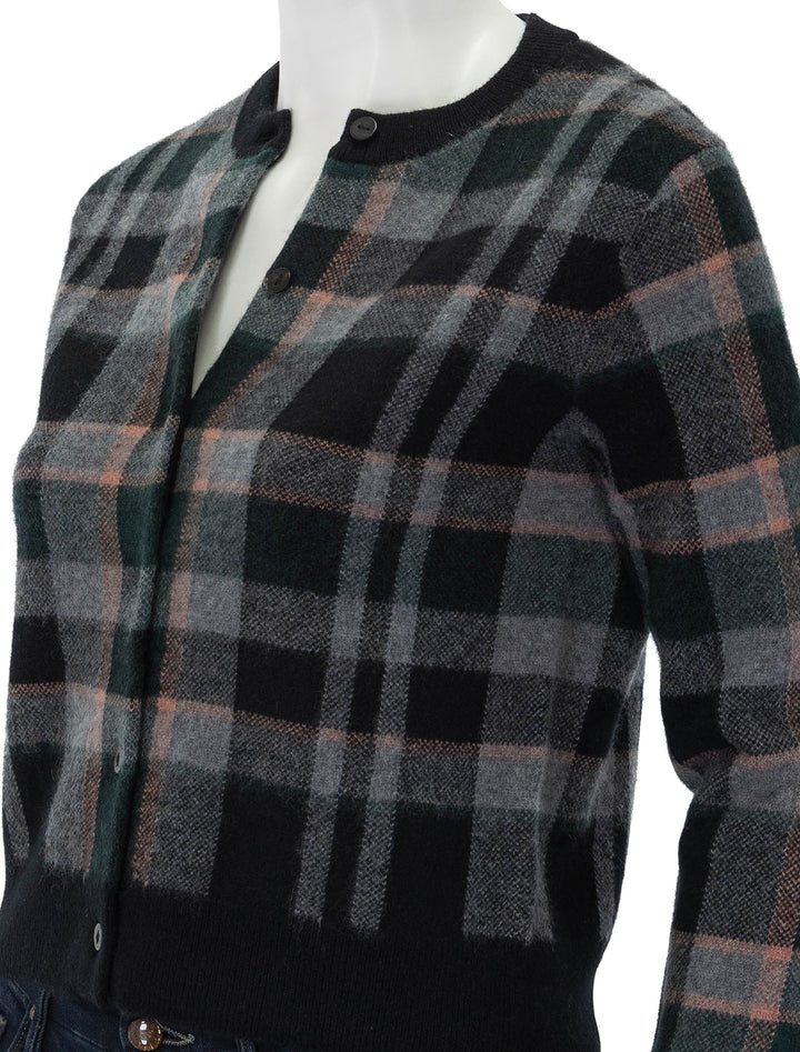 Close-up view of Vince's plaid cardigan.