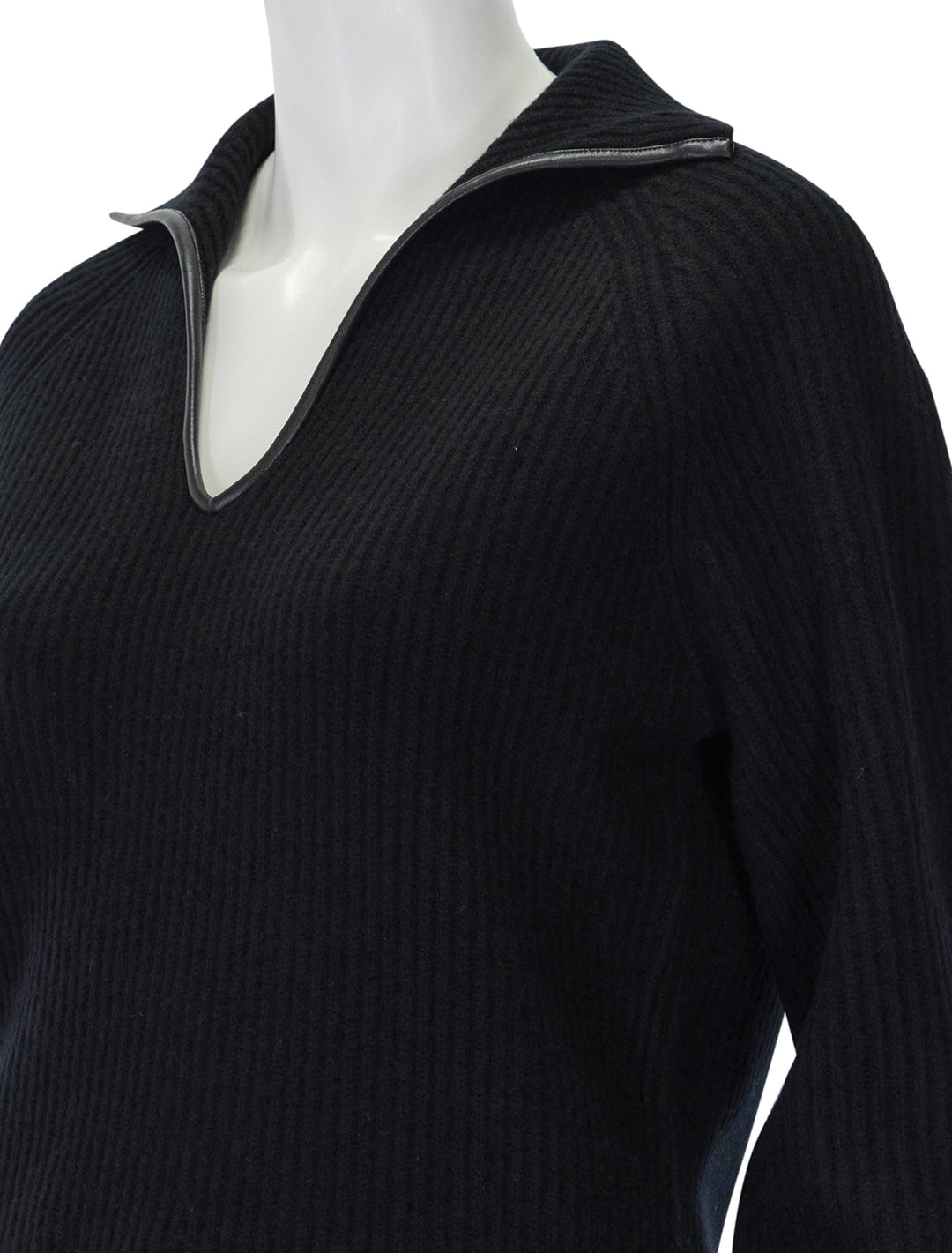 Close-up view of Vince's leather trim ribbed polo pullover in black.