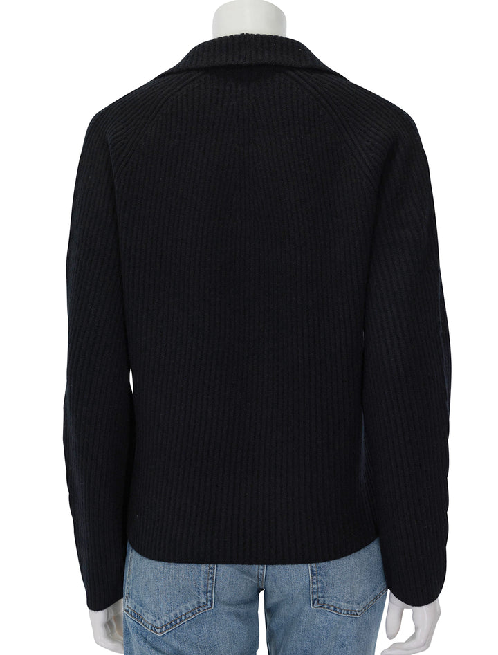 Back view of Vince's leather trim ribbed polo pullover in black.