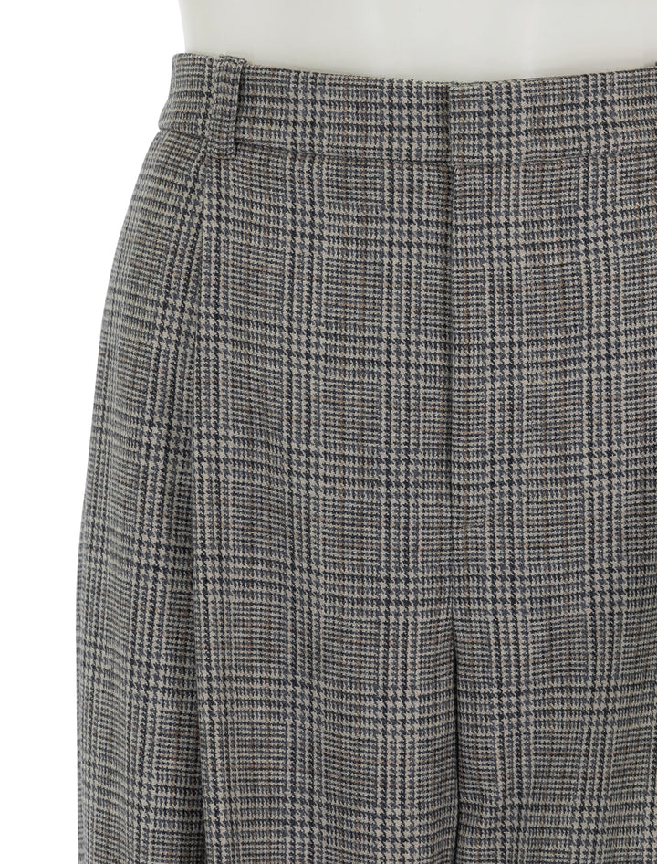 Close-up view of Vince's high rise wool blend plaid trouser in heritage plaid.