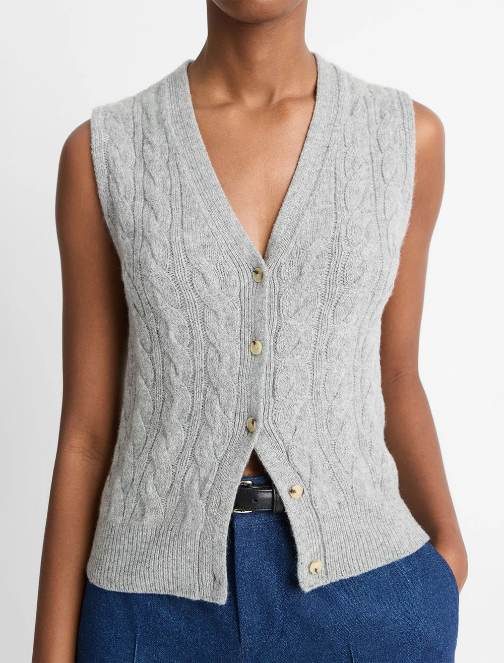 Model wearing Vince's cable button vest in heather silver dust.