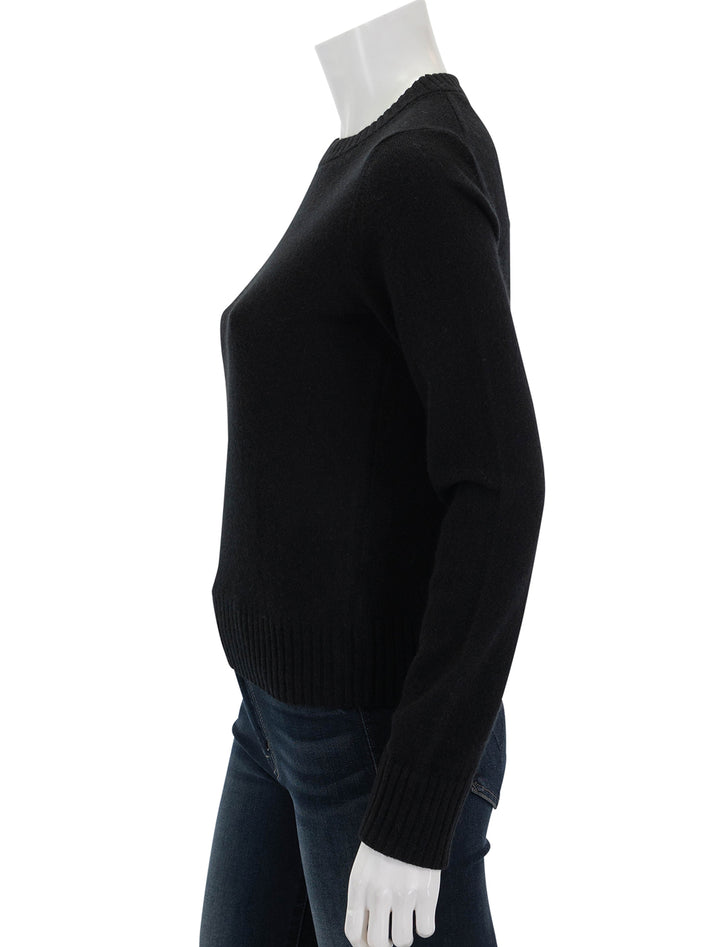 side view of classic crew neck pullover in black