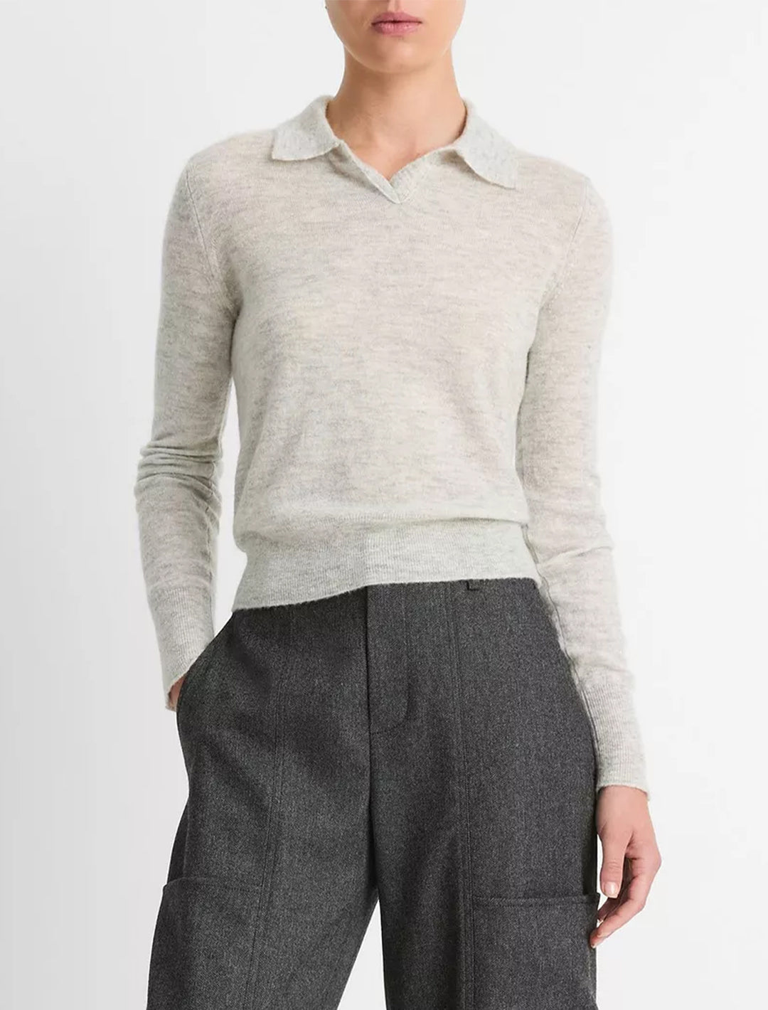 Model wearing Vince's silk blend collar crew neck in mist grey.