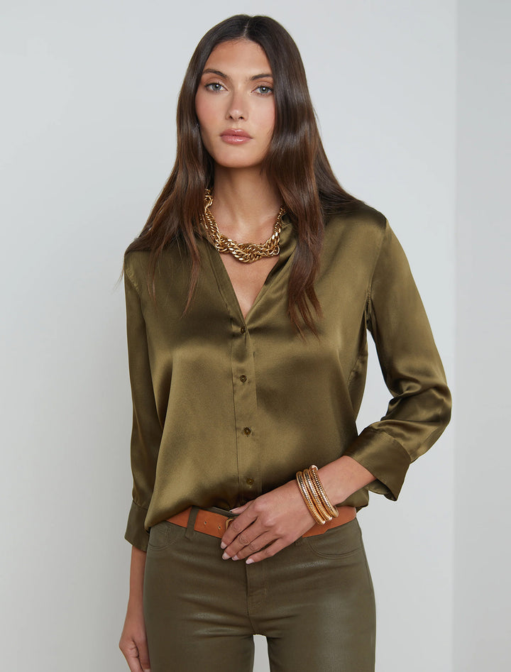 Model wearing L'Agence's dani blouse in pine.